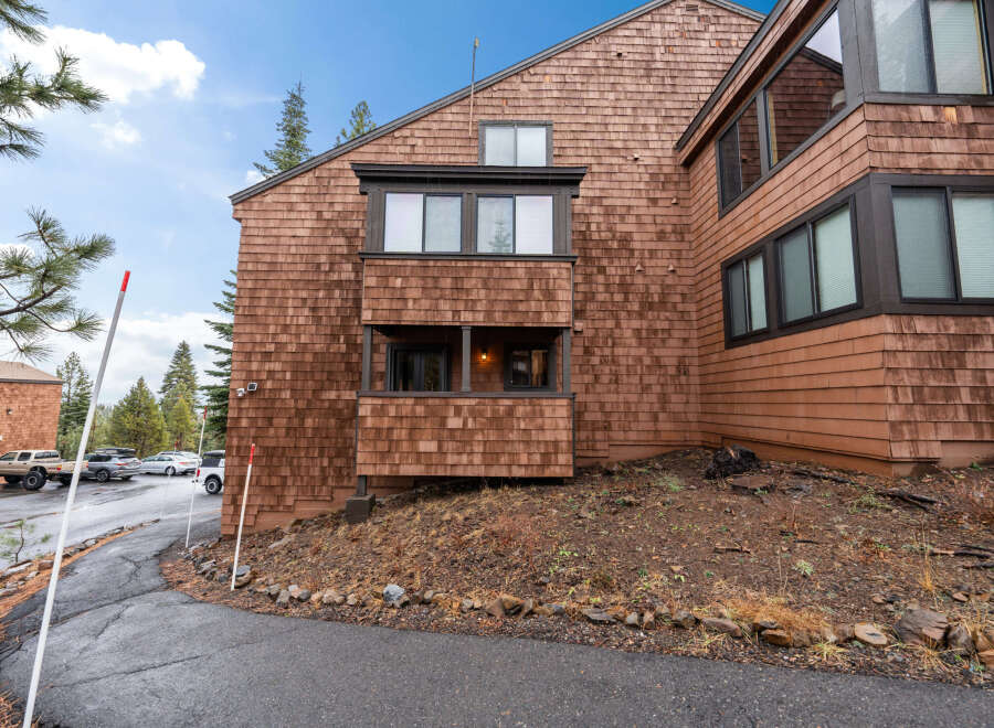 This stunning property boasts a unique architectural design with cedar shake siding, offering a warm and inviting aesthetic.