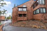 This stunning property boasts a unique architectural design with cedar shake siding, offering a warm and inviting aesthetic.