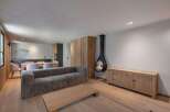 This stunning living space boasts a modern design with a cozy fireplace, perfect for relaxing evenings.