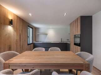 This stunning property features a modern kitchen with sleek cabinetry and stainless steel appliances.