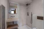 This modern bathroom features a sleek design with a minimalist aesthetic.