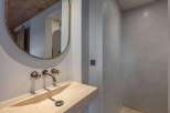 Experience luxury in this stunning bathroom featuring a sleek, modern design.