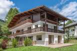 This stunning property showcases a beautiful chalet-style design, perfect for those seeking a blend of rustic charm and modern comfort.
