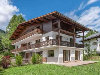 This stunning property showcases a beautiful chalet-style design, perfect for those seeking a blend of rustic charm and modern comfort.