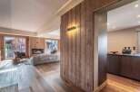 Experience the warmth and elegance of this stunning property, featuring exquisite wood paneling and flooring throughout.