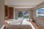This stunning bedroom boasts a cozy and inviting atmosphere, perfect for relaxation.