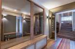 This stunning property boasts a modern interior with a focus on natural materials.