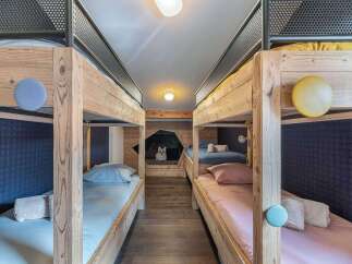 This charming bunk room offers a cozy and inviting space for guests.