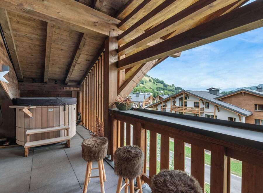 Enjoy breathtaking mountain views from this luxurious balcony.