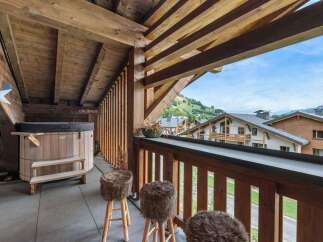 Enjoy breathtaking mountain views from this luxurious balcony.