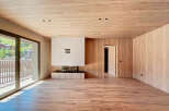 Experience luxury living in this stunning property featuring a modern fireplace and elegant wooden accents throughout.