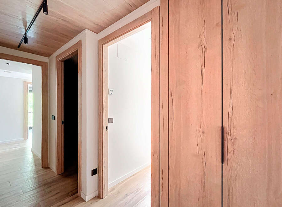 Step into this beautifully designed hallway, showcasing a seamless blend of modern and natural elements.
