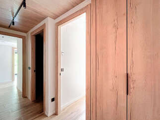Step into this beautifully designed hallway, showcasing a seamless blend of modern and natural elements.