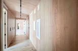 Step into luxury with this stunning hallway, showcasing exquisite wood paneling and a modern design.