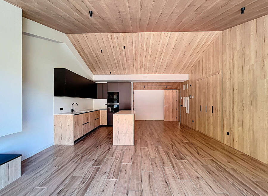This stunning property boasts a modern interior with a warm, inviting atmosphere.