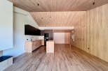 This stunning property boasts a modern interior with a warm, inviting atmosphere.