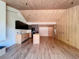 This stunning property boasts a modern interior with a warm, inviting atmosphere.