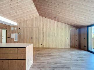 This stunning property boasts a modern, minimalist design with natural wood finishes throughout.