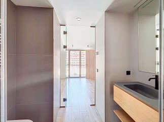 Step into modern luxury with this stunning property! Featuring a sleek bathroom design with a floating vanity and a glass-enclosed shower, this home offers both style and functionality.