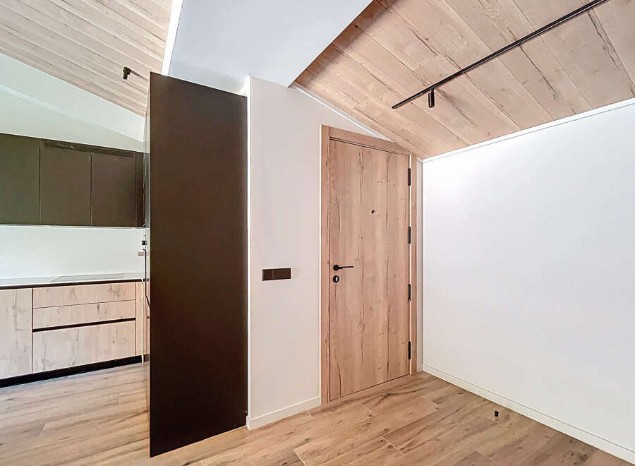 This stunning property boasts a modern interior design with a focus on natural materials.