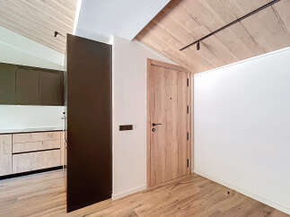 This stunning property boasts a modern interior design with a focus on natural materials.