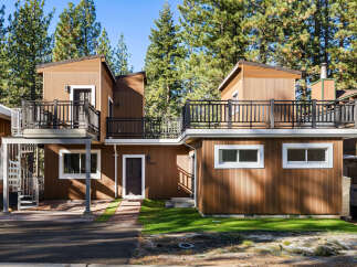 This charming property features a unique architectural design with a warm, inviting facade.