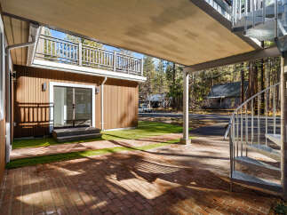 Discover the charm of this stunning property, featuring a unique spiral staircase and a covered patio area perfect for outdoor relaxation.