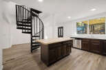 This stunning property features a modern kitchen with a large island and stainless steel appliances.