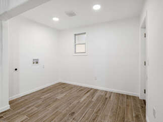 This bright and airy room features a neutral color palette, creating a versatile space for various purposes.