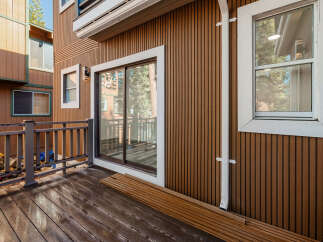 This stunning property boasts a beautiful wooden deck, perfect for enjoying the outdoors.