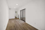 Step into this bright and airy space, featuring beautiful wood-look flooring that extends throughout.