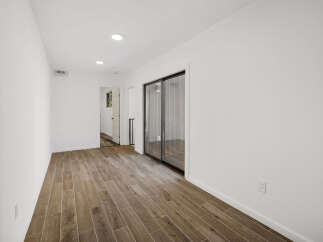 Step into this bright and airy space, featuring beautiful wood-look flooring that extends throughout.