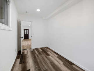 Step into this inviting space, featuring a modern design and neutral color palette.