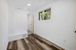 Step into this bright and airy room, featuring beautiful wood-look flooring that adds warmth and style.