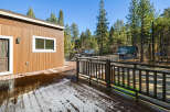 This stunning property boasts a beautiful wooden deck, perfect for enjoying the serene surroundings.