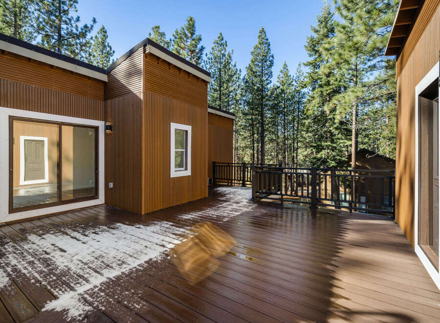 This stunning property boasts a beautiful wooden deck, perfect for enjoying the serene surroundings.