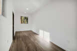 Step into this bright and airy space, featuring beautiful wood-look tile flooring that adds warmth and character.