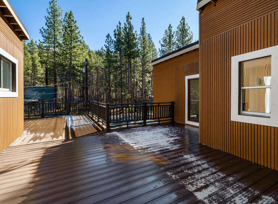 Enjoy the tranquility of this stunning property featuring a spacious deck perfect for outdoor gatherings.