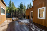 Enjoy the tranquility of this stunning property featuring a spacious deck perfect for outdoor gatherings.