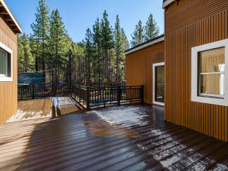 Enjoy the tranquility of this stunning property featuring a spacious deck perfect for outdoor gatherings.