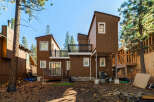 This stunning property boasts a modern design with a unique architectural style, featuring a beautiful brown exterior and multiple levels.