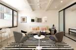 Step into modern elegance with this stunning property, featuring a stylish living area.