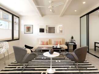 Step into modern elegance with this stunning property, featuring a stylish living area.
