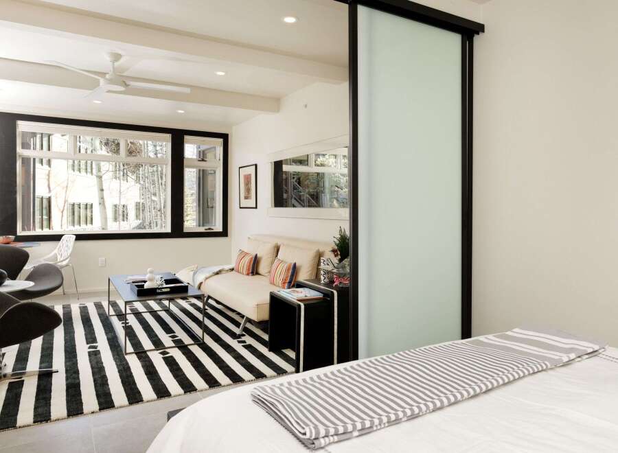 This modern living space features a stylish design with a focus on comfort and functionality.