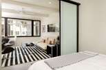 This modern living space features a stylish design with a focus on comfort and functionality.