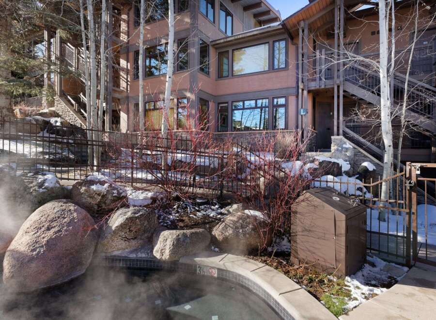 Experience luxury living in this stunning property featuring a private hot tub, perfect for relaxation.