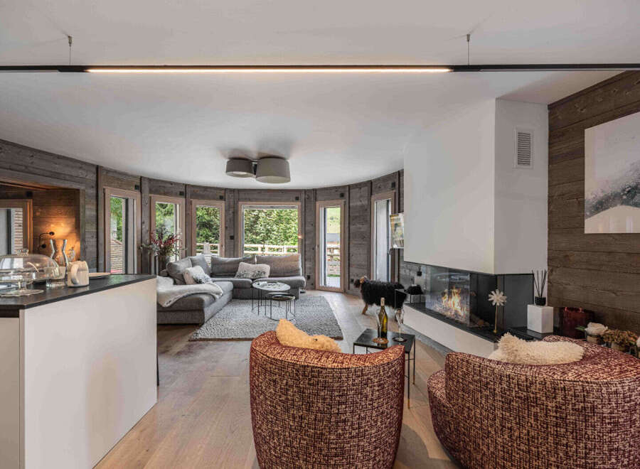 Experience luxury living in this stunning property! Featuring a modern fireplace, expansive windows, and a cozy seating area, this home offers the perfect blend of comfort and style.