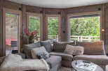 This cozy living room features a comfortable sectional sofa, perfect for relaxing.