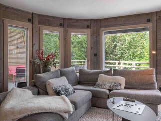 This cozy living room features a comfortable sectional sofa, perfect for relaxing.