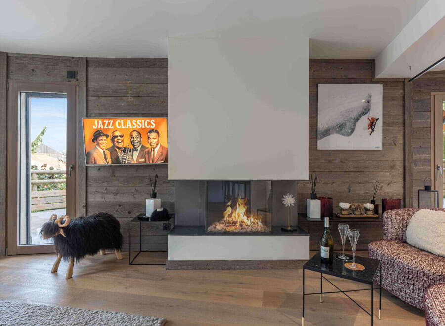 Experience luxury living in this stunning property featuring a cozy fireplace, perfect for chilly evenings.